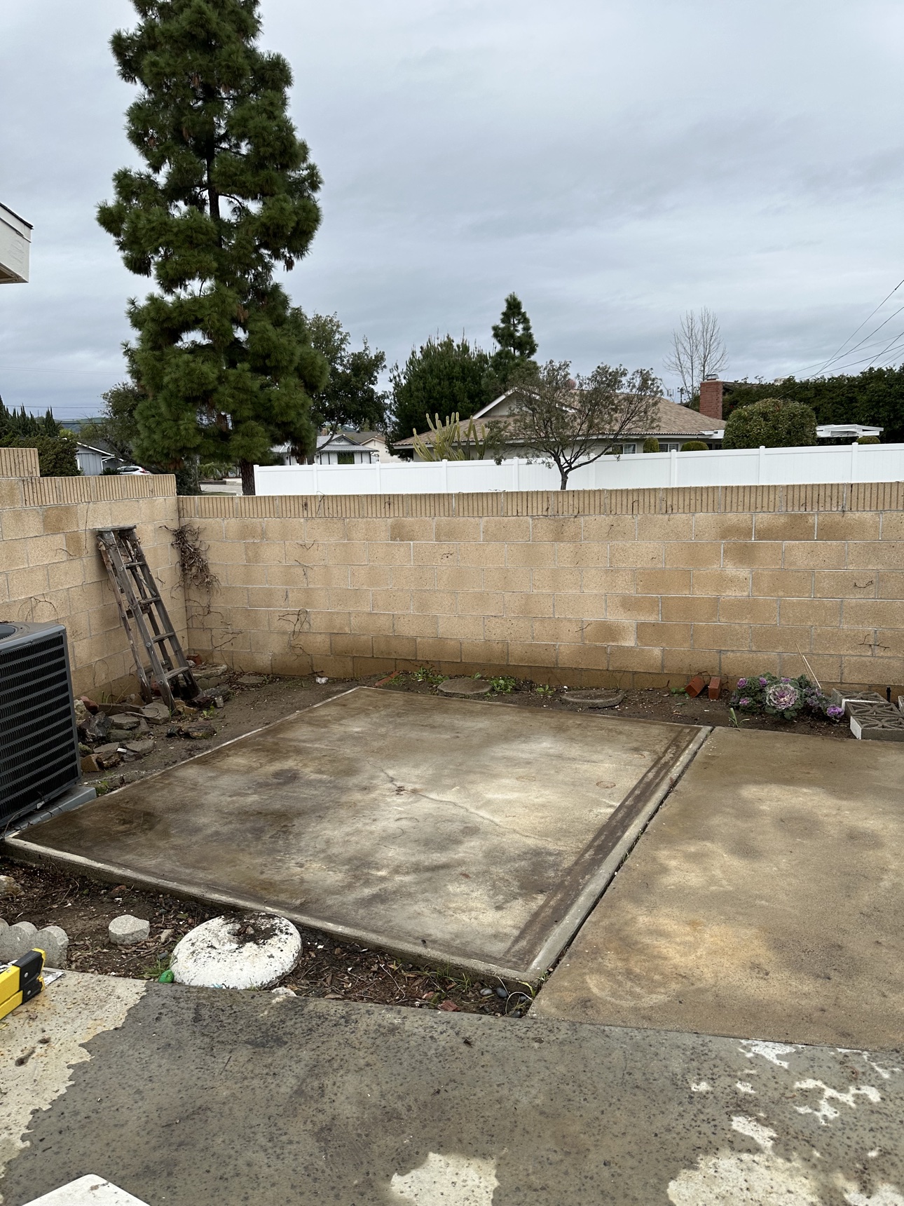 Cleared concrete pad after a Fullerton property cleanup